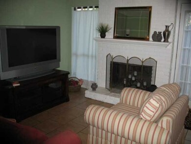Den with wood burning fireplace New 12