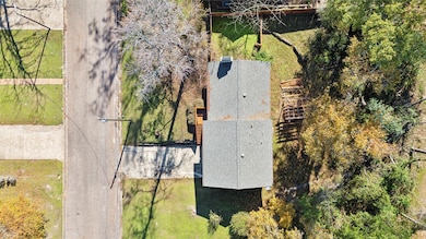 This aerial view shows a two-story home with a gra
