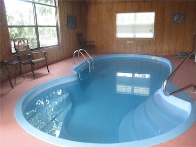 Solar heated pool inside the screen porch