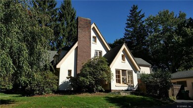 Gorgeous updated tudor on over an acre of privacy.