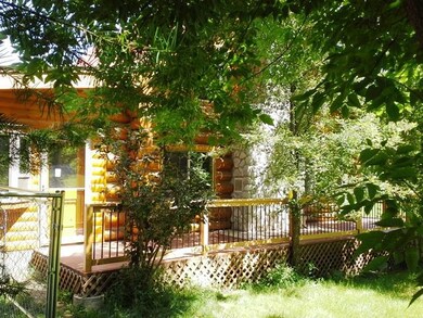 The deck & river rock chimney