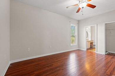 Unfurnished bedroom with a closet, baseboards, cei