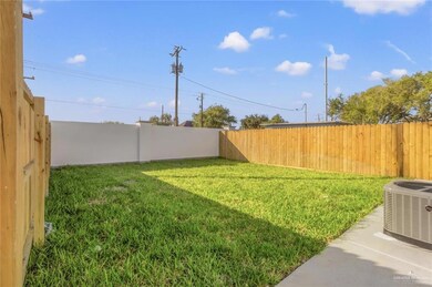 View of fenced backyard