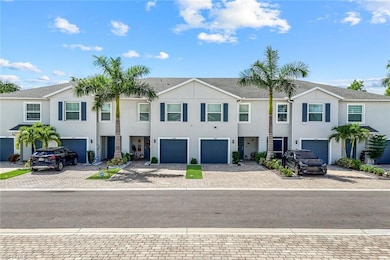 View of front facade featuring driveway, stucco siding, an attached garage, and a shingled roof
