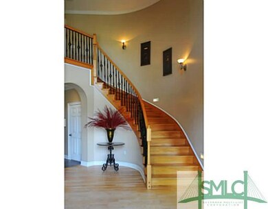 Foyer. The curving staircase is very elegant! What