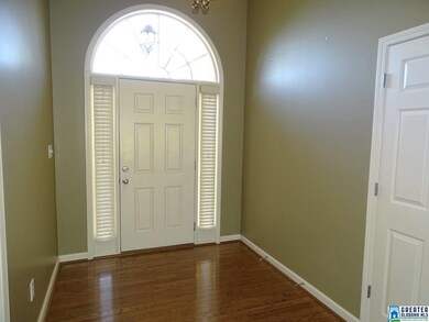 Spacious foyer with gleaming floors.