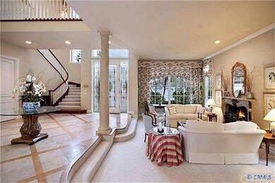 Two story stone floor foyer with views of the form