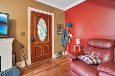 Perfectly situated on a CORNER LOT along a picturesque TREE-LINED street, this lovingly maintained HISTORIC home invites you in with a beautiful STAINED-GLASS WINDOW accenting the front door, a nod to its rich architectural heritage.