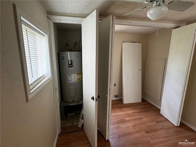 Utility room featuring water heater