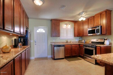 Kitchen with door entry from west