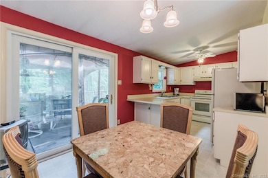 Dining area open to living room and slider's to back deck.