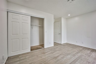 Unfurnished bedroom featuring wood finished floors