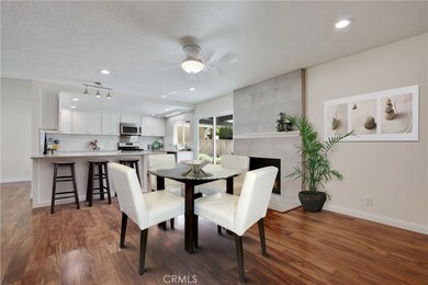 Beautifully tiled fireplace.  Area off kitchen could be used as family room or dining room.