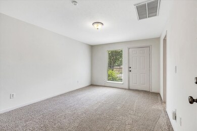 Private 1st floor bedroom featuring a walk-in clos