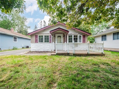 View of front of property with a front lawn and wo