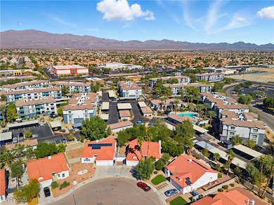 Aerial perspective of suburban area featuring a mountain backdrop