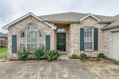 View of front facade featuring a garage