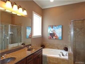 THE MAIN BATH FEATURS A DOUBLE SINK VANITY