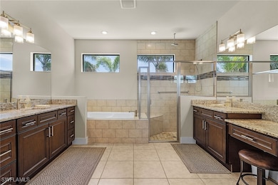 Bathroom featuring tile patterned flooring, a sink