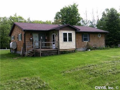 Exterior Back. Nice deck and the light part of the