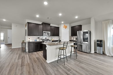 Spacious and open-concept kitchen and dining area,