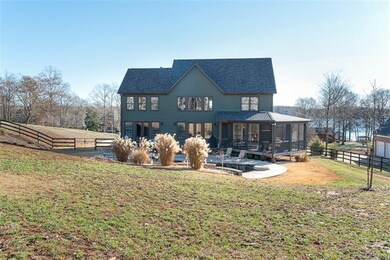 back of home with gorgeous view of pool and main c