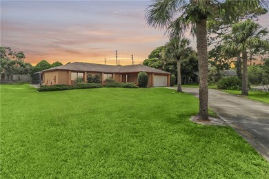 Oversized QUARTER ACRE LOT with Palm-Lined Drivewa