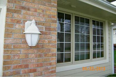 Exterior Front. Cement board siding, brick and ups
