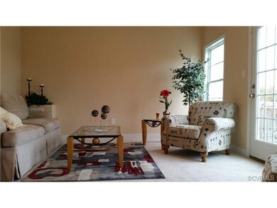 Living room w/ deck overlooking the pool