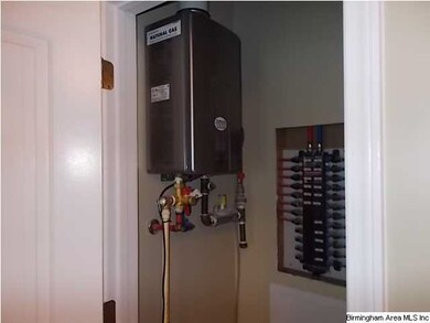 Utility closet houses the tankless water heater.