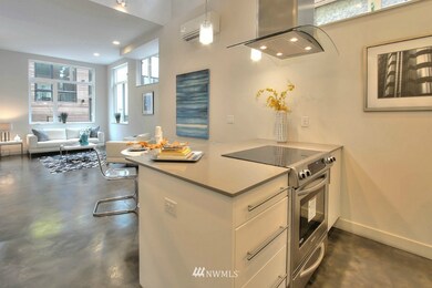 Gorgeous Quartz Countertop, flat stove, very sleek for the modern eye!