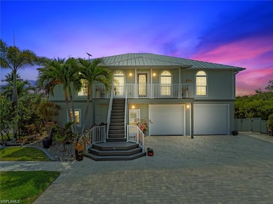 Coastal home with a garage, covered porch, stucco 