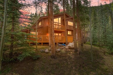 Rear view of property featuring a balcony, board a