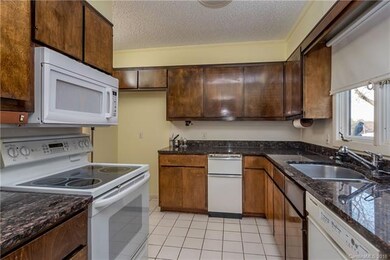 Kitchen includes granite counter tops