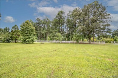 View of yard with a rural view