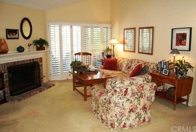 SPACIOUS LIVING ROOM WITH COZY FIREPLACE AND BALCO