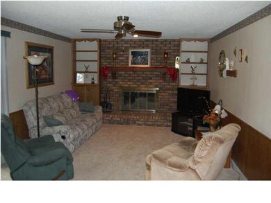 MAIN FLOOR FAMILY ROOM WITH FIREPLACE AND SLIDING 