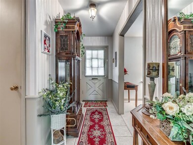 Entryway featuring light tile floors