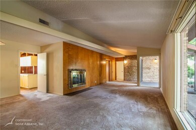 Front living room has lots of space and light! Ope