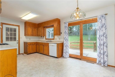 Eat-in kitchen with a garden window over the sink.