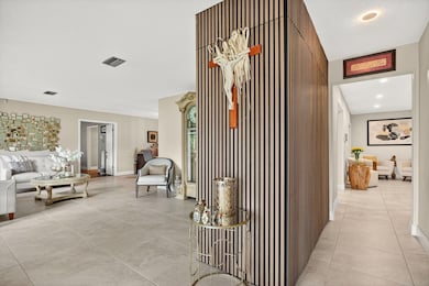 Beautiful entry with 24 inch tiles through living areas.