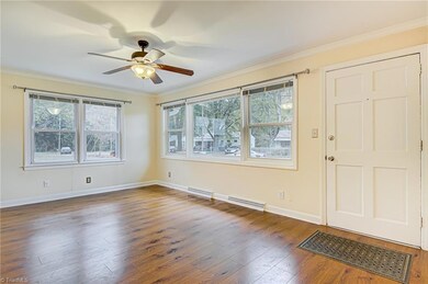 This beautiful living room boasts large windows that let in plenty of natural lights!