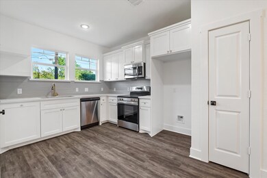 Custom, solid wood cabinets, neutral finishes, gol