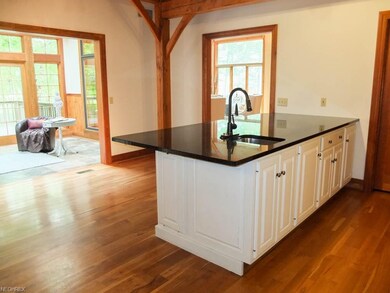 Kitchen is open to the sunroom.