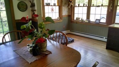 Large sunlit dining room area.