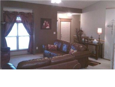 Entry and living room looking from dining area