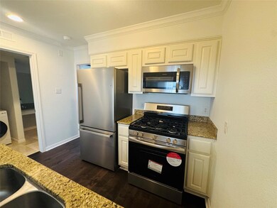 Kitchen featuring stainless steel appliances, dar