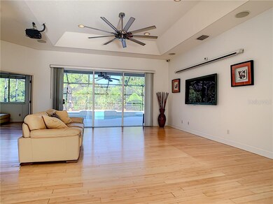 Great room with tray ceiling. Den at left