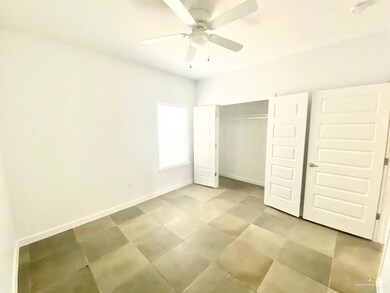 Unfurnished bedroom with a closet and ceiling fan