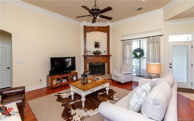 Living room with corner gas log fireplace overlook